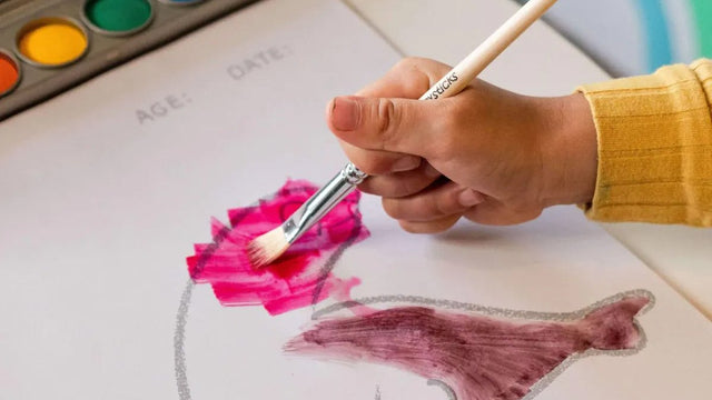 Child painting during an arts and crafts activity