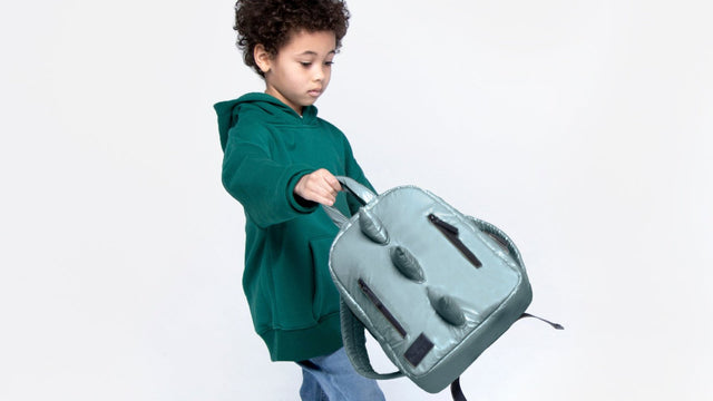 Child wearing a kids backpack