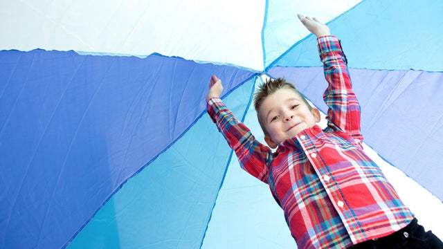 Young child playing outdoors on a bright day