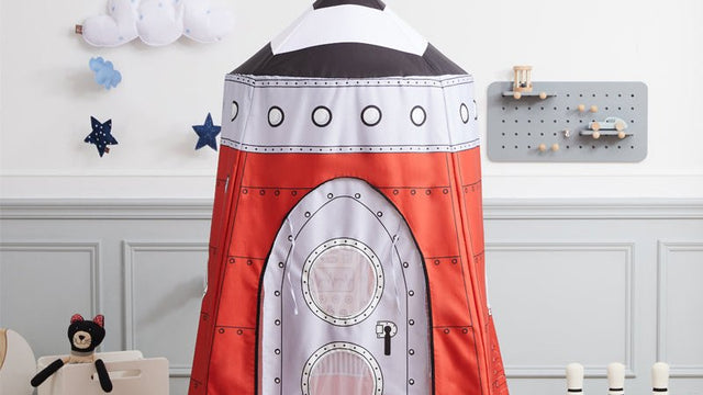 Rocket play tent set up in a child's room