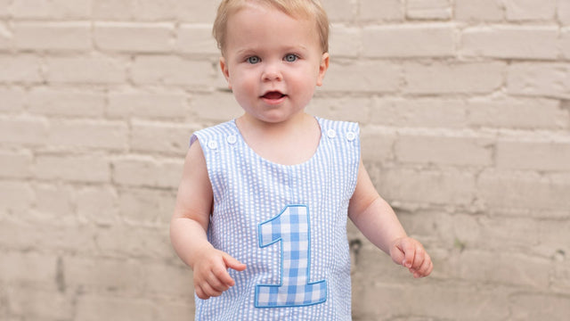 Baby boy in a first birthday outfit