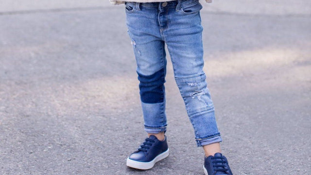 Child wearing lace-up sneakers