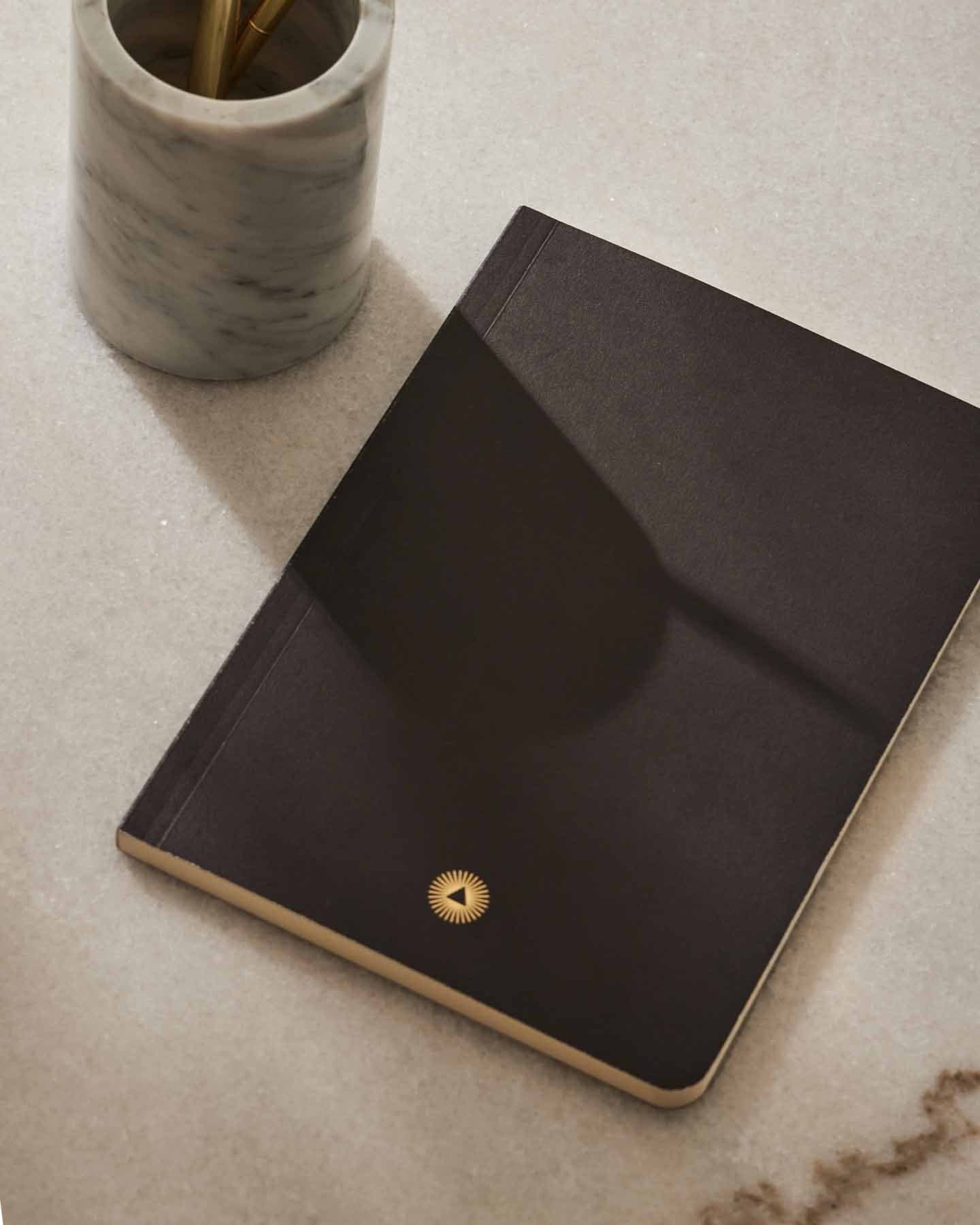 Essential notebook by Intelligent Change created with bespoke paper and made in Germany, Lined long-form journaling notebook with dated pages. Black
