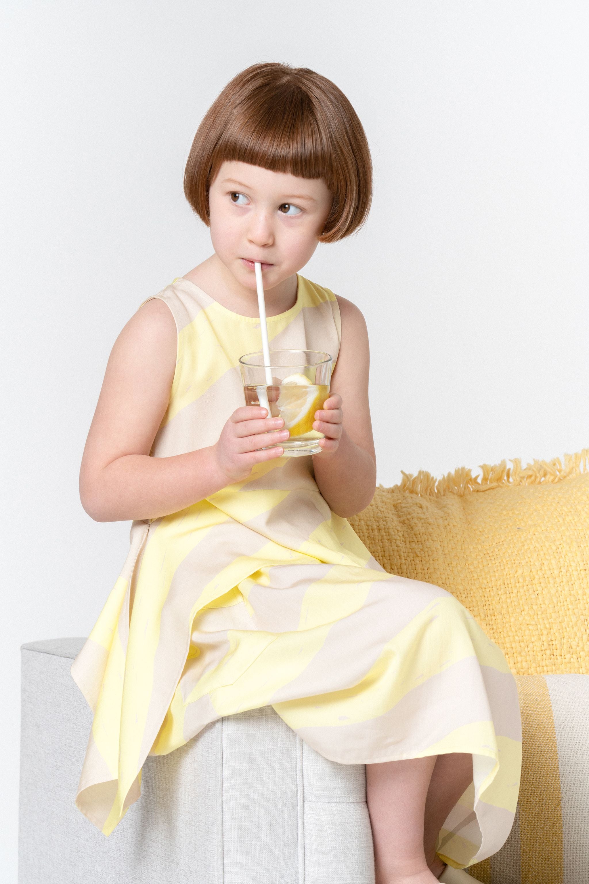 Girls Sleeveless Peplum Top With Side Tails | Yellow