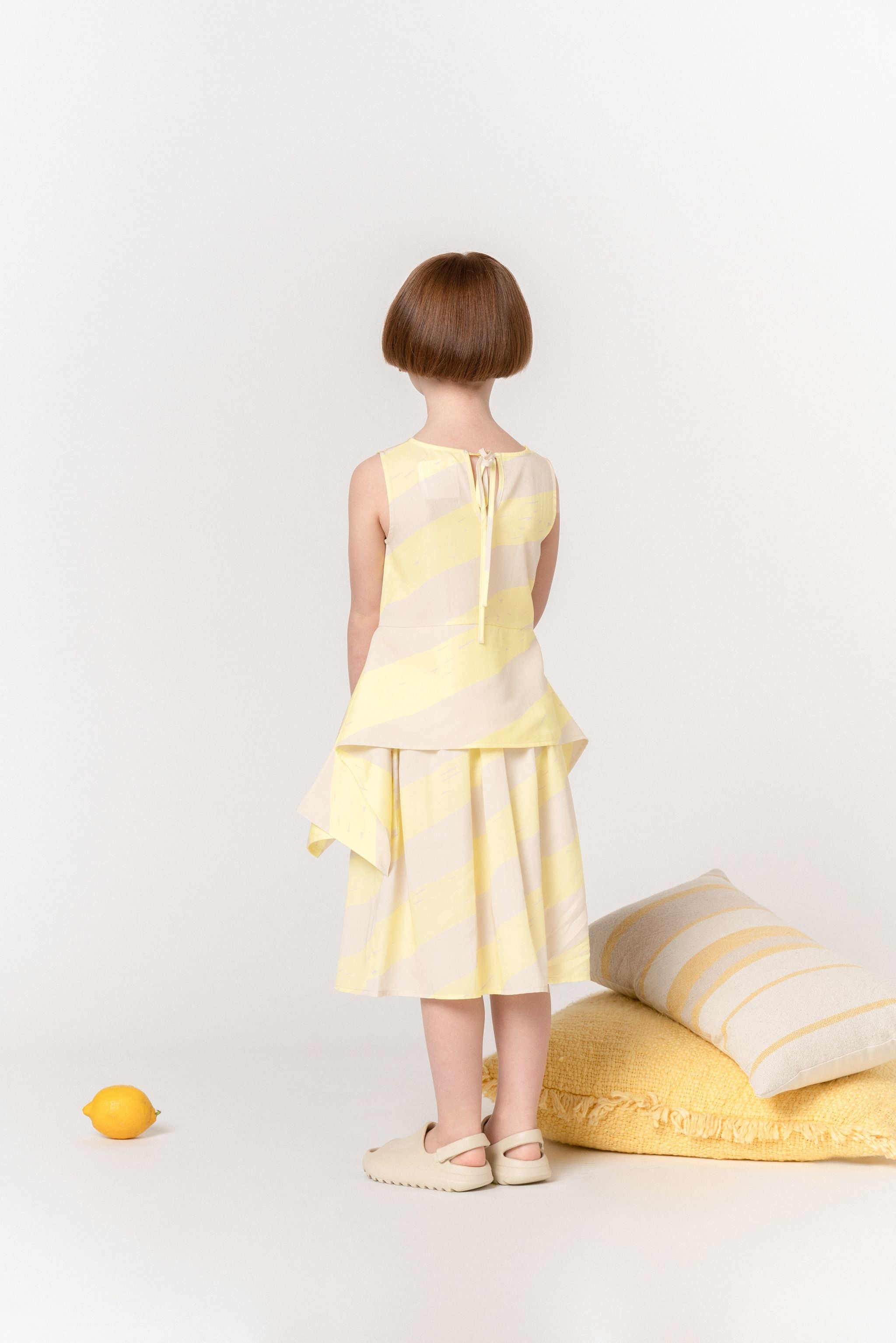 Girls Sleeveless Peplum Top With Side Tails | Yellow