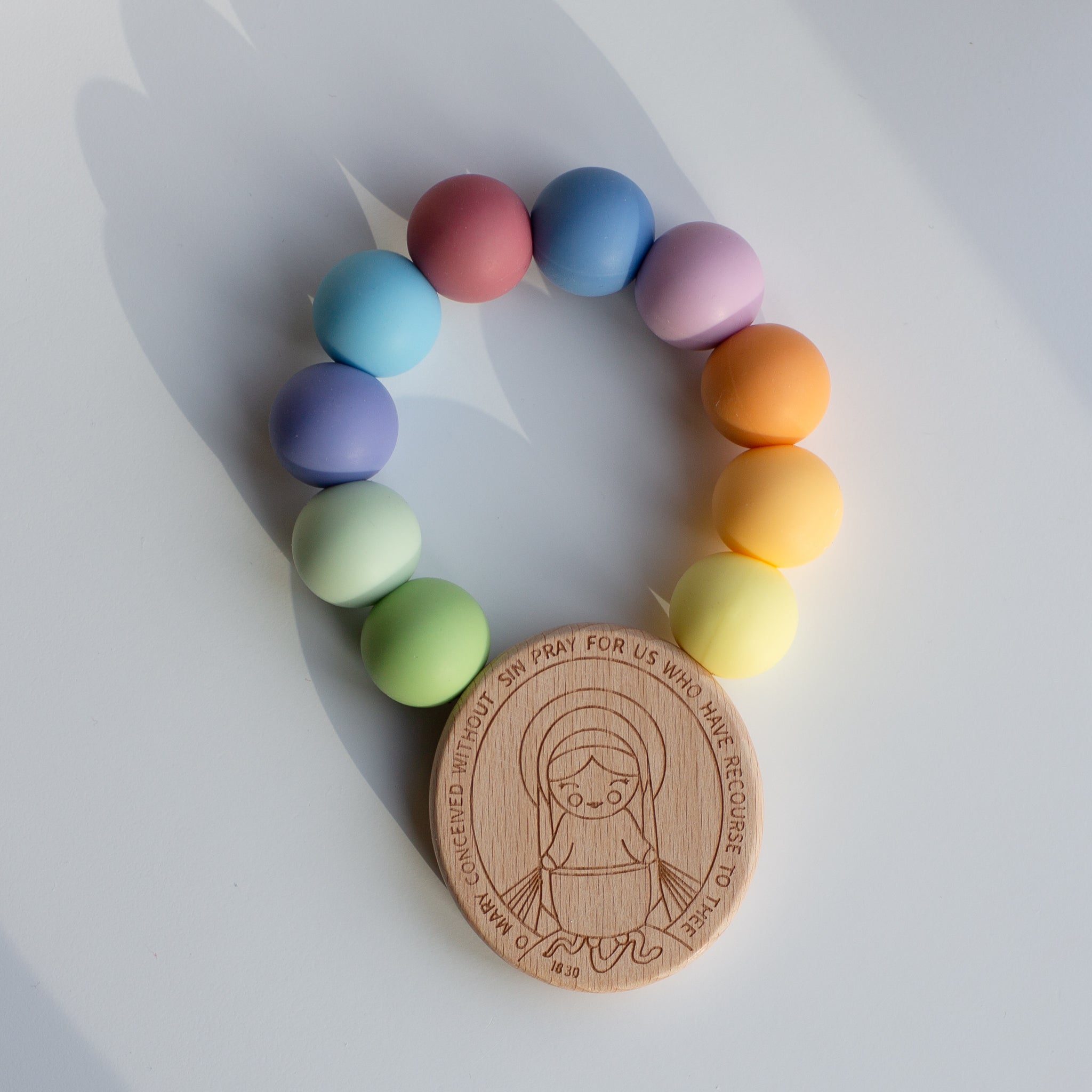 Baby's First Miraculous Medal Teether - Rainbow Of Hope