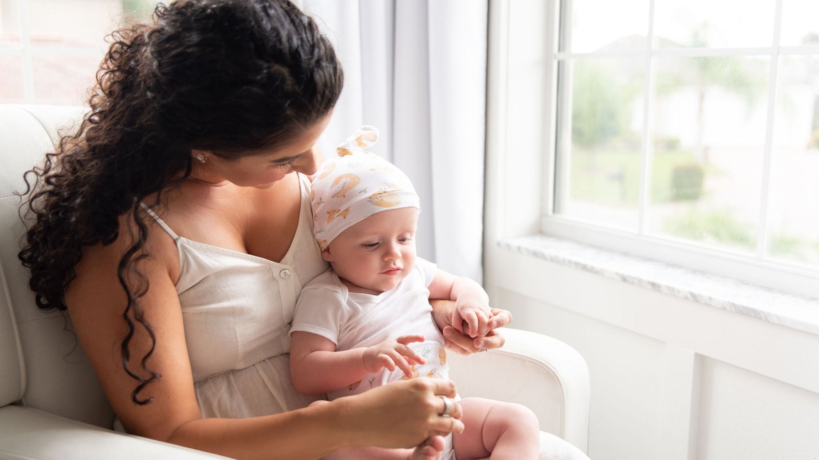 Parent comforting a baby who is unwell
