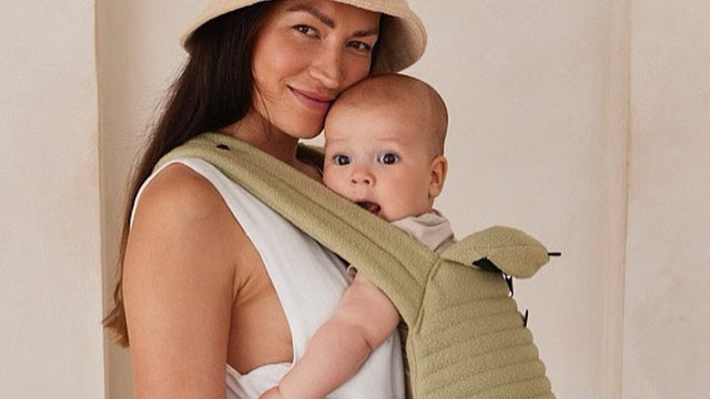 Parent babywearing their baby