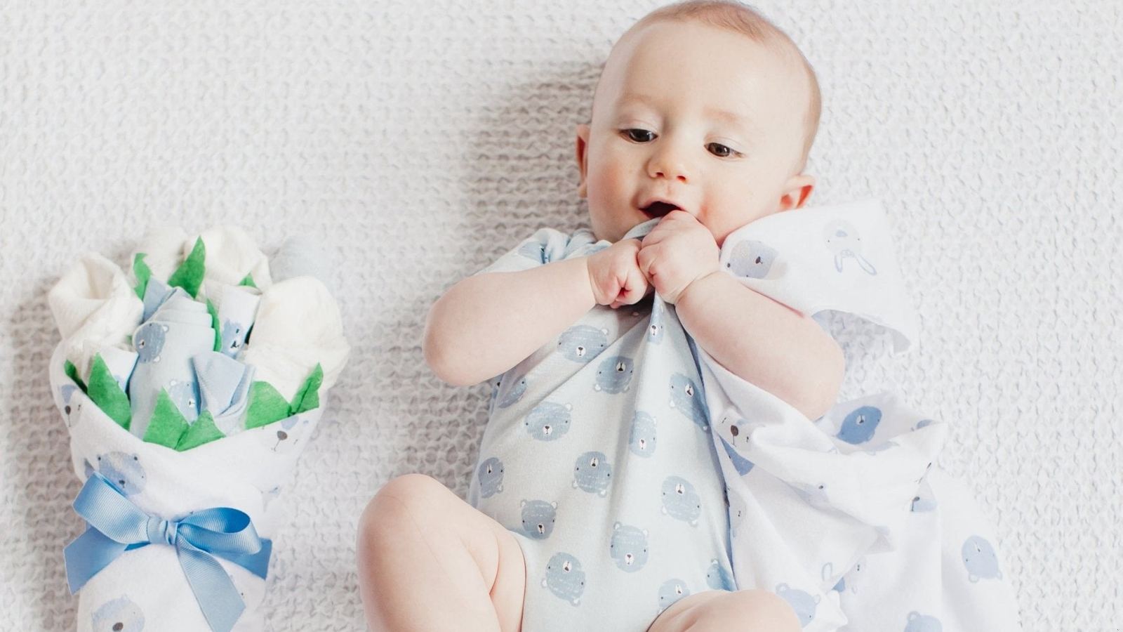 Baby with a newborn gift set