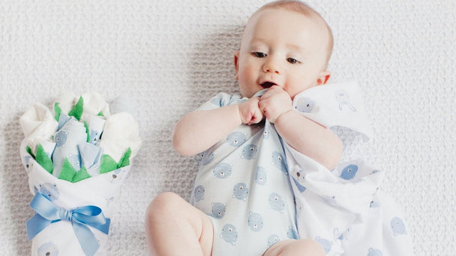 Baby with a newborn gift set