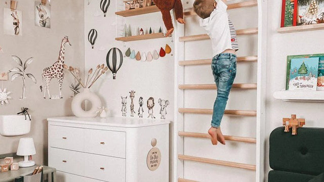 Child climbing and balancing on wooden play equipment