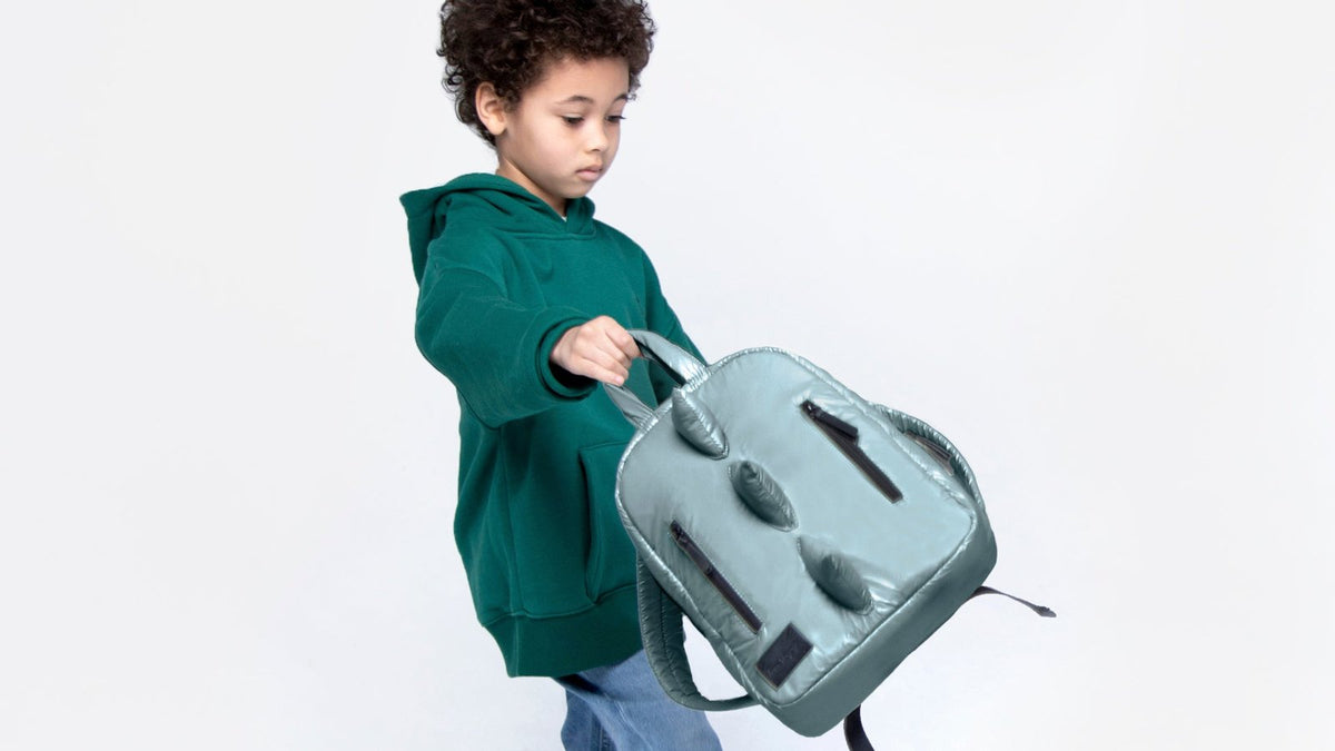 Child wearing a kids backpack
