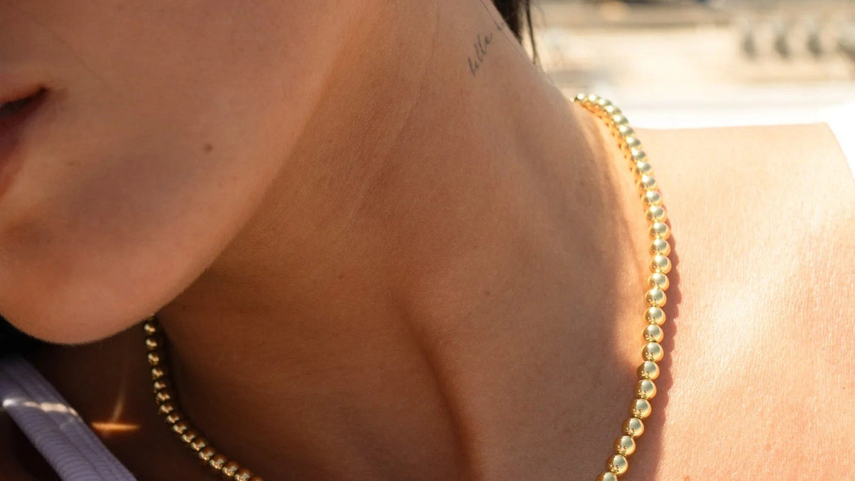 Woman wearing a delicate gold necklace