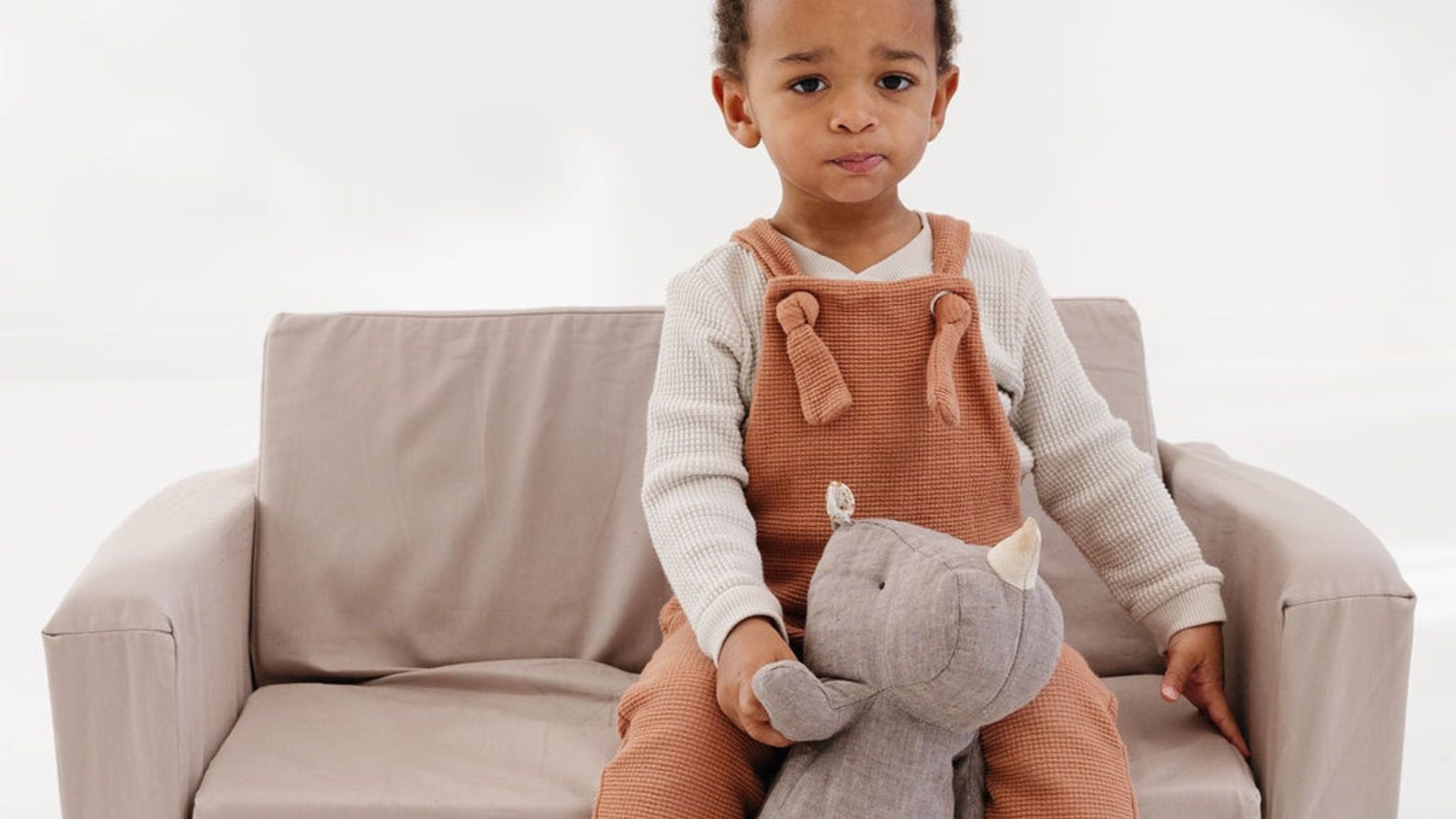 Child sitting on a modular kids play couch