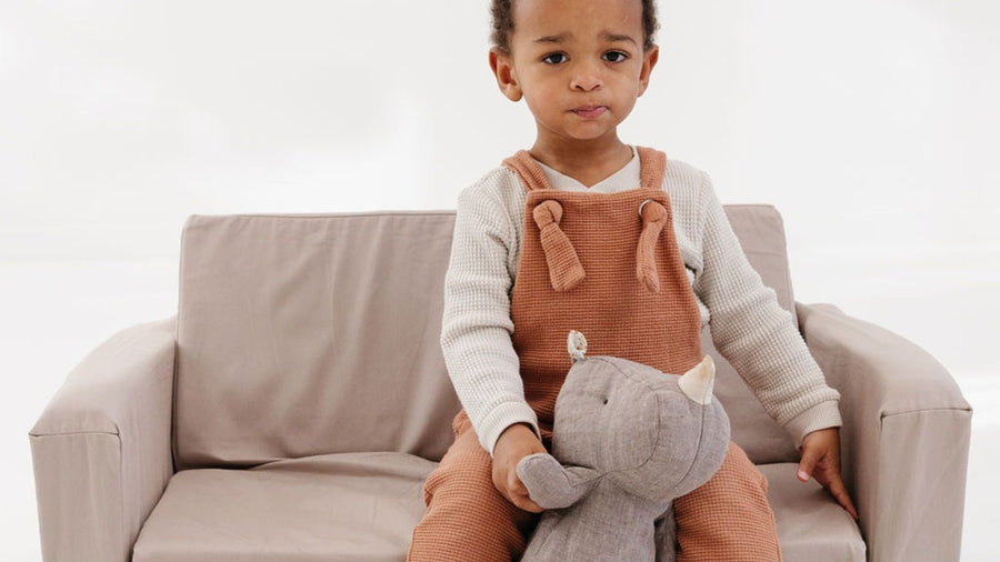 Child sitting on a modular kids play couch