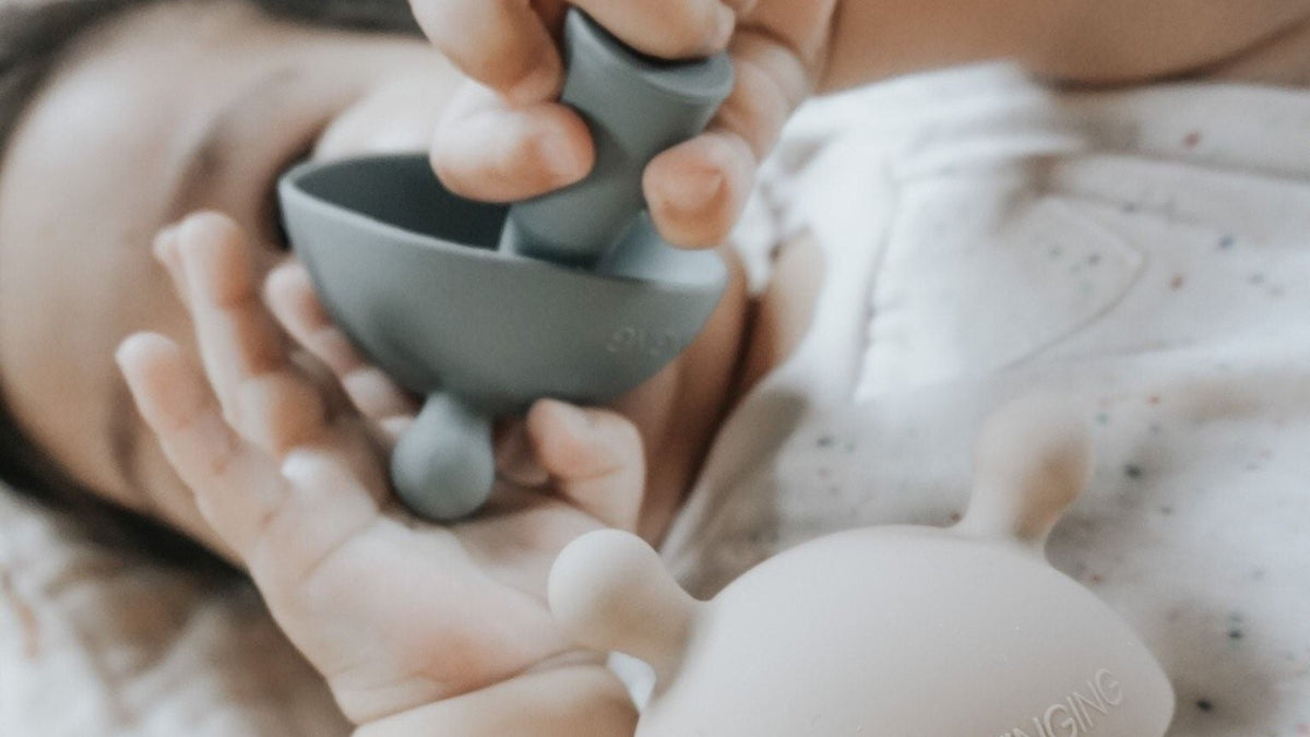 Baby holding a teether