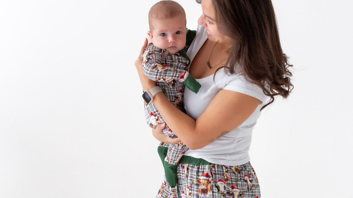 Parent holding baby at home