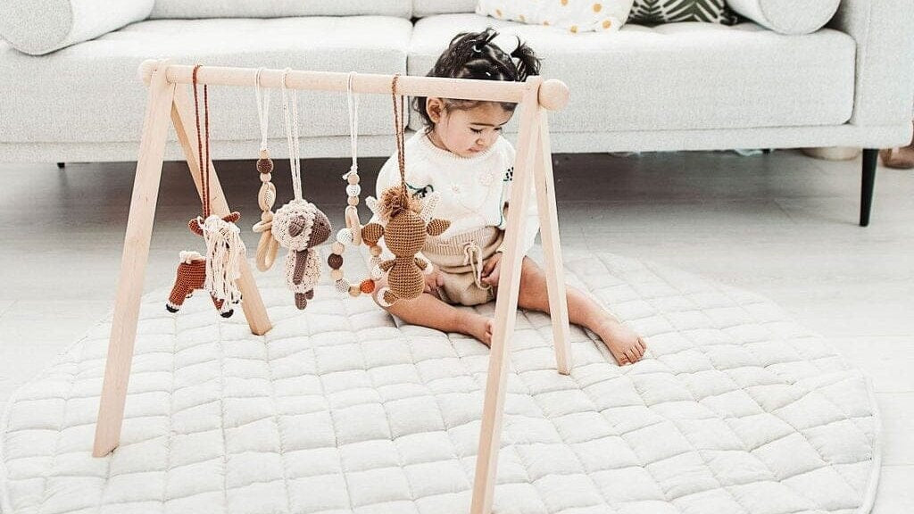 Baby playing on a mat