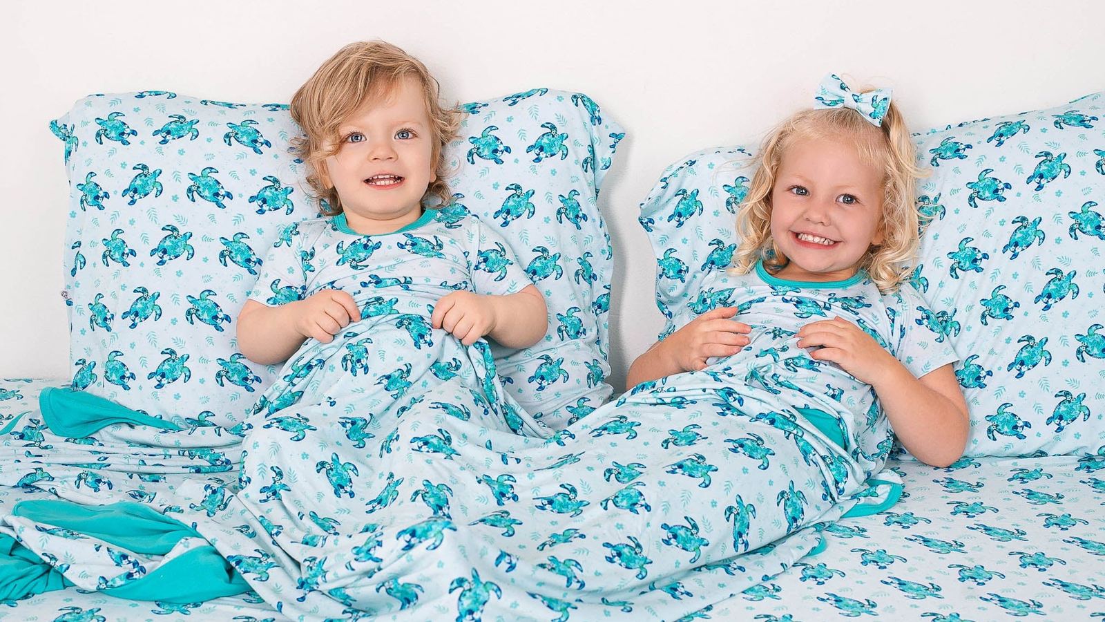 Twin toddlers in matching outfits