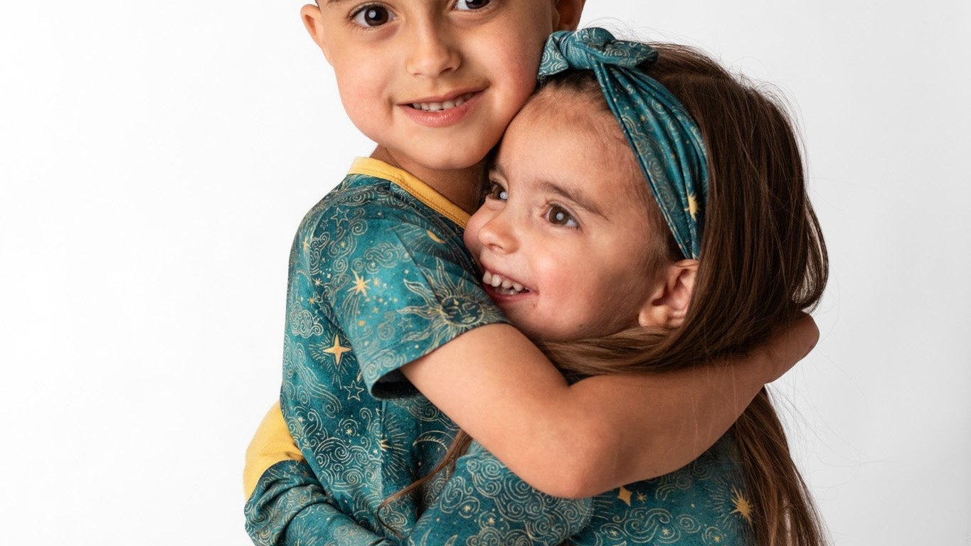 Two young siblings together