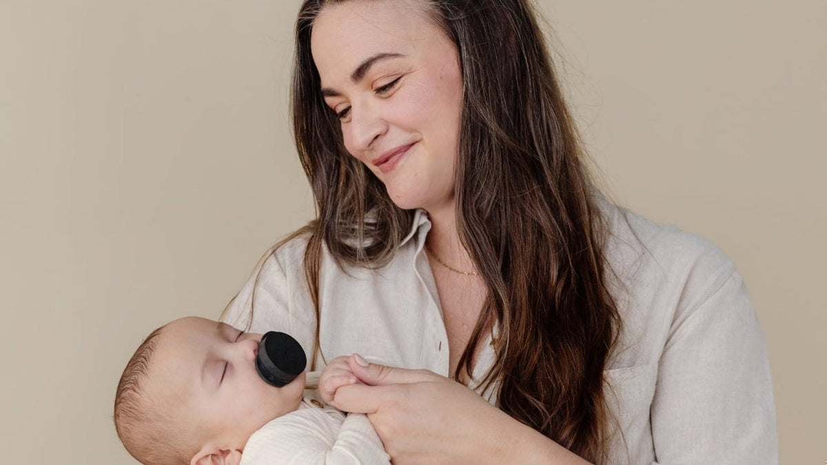 Parent soothing a baby