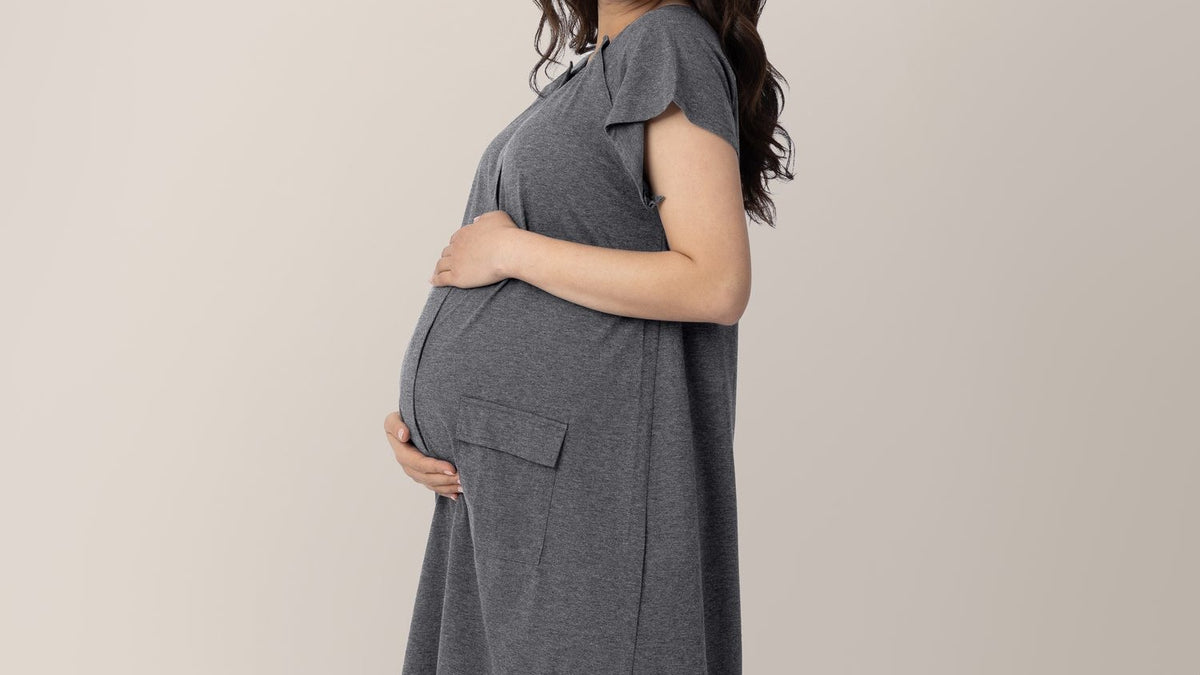 Pregnant woman cradling her belly