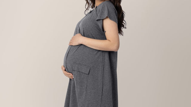Pregnant woman cradling her belly