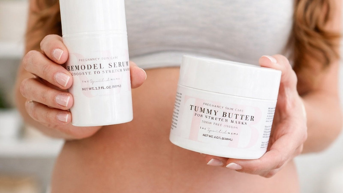 Pregnant woman holding a jar of tummy butter and a bottle of serum in front of her bare bump