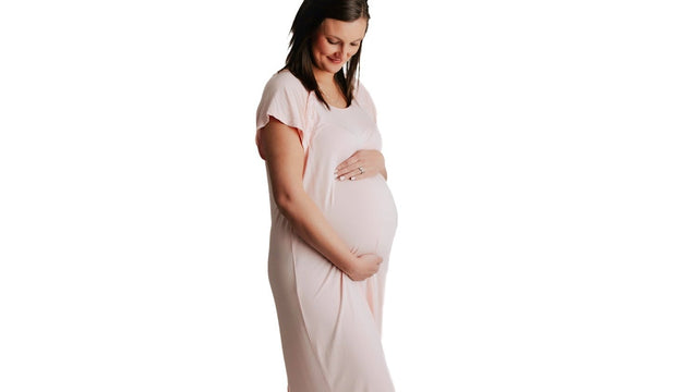 Pregnant woman in a nightgown