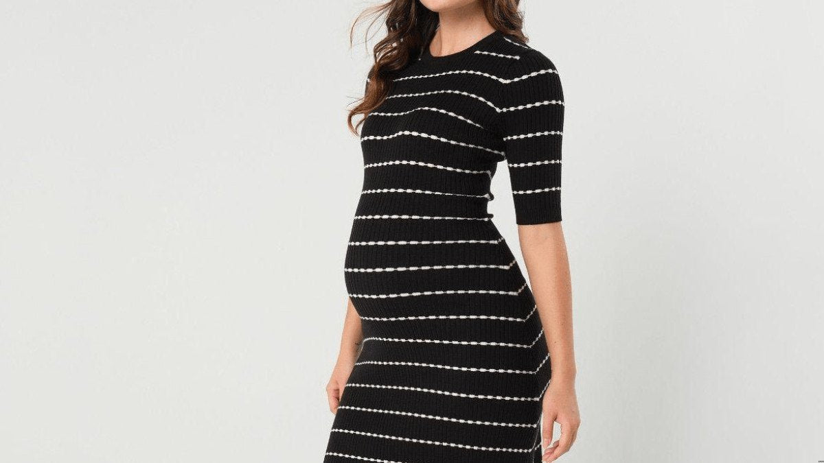 Expectant mother holding her belly