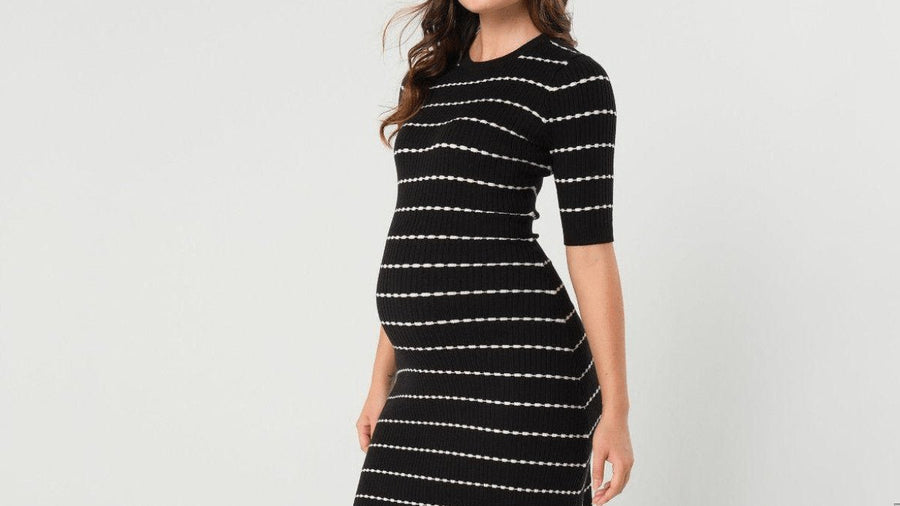Expectant mother holding her belly