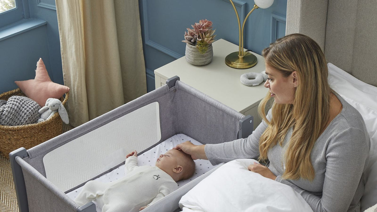 Baby sleeping safely in a bassinet