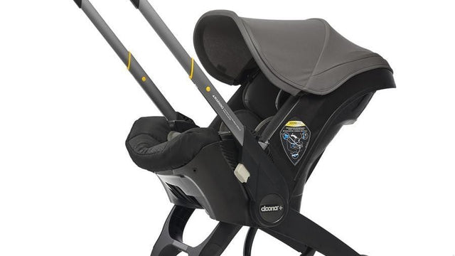 Baby buckled safely in a car seat
