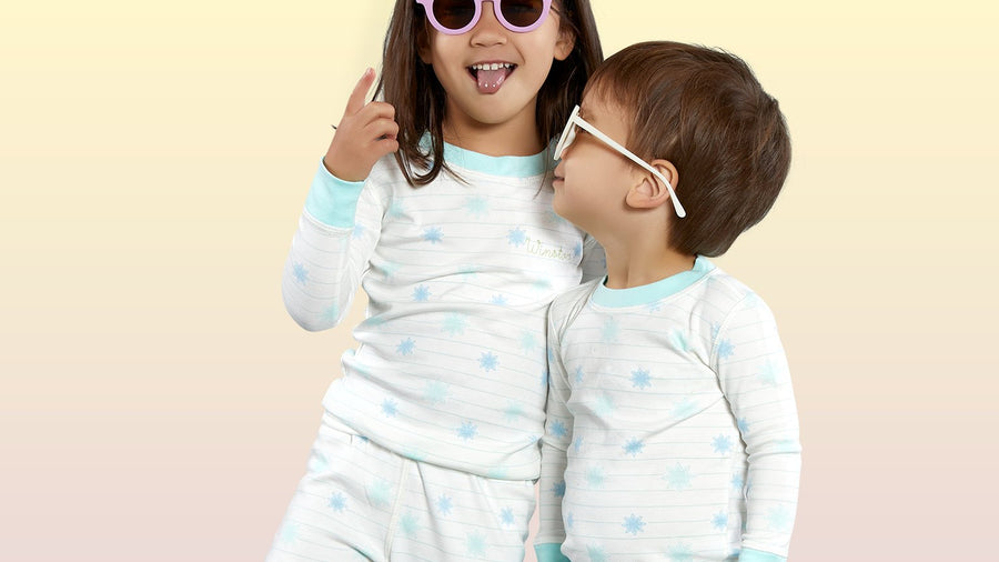 Two siblings in matching outfits