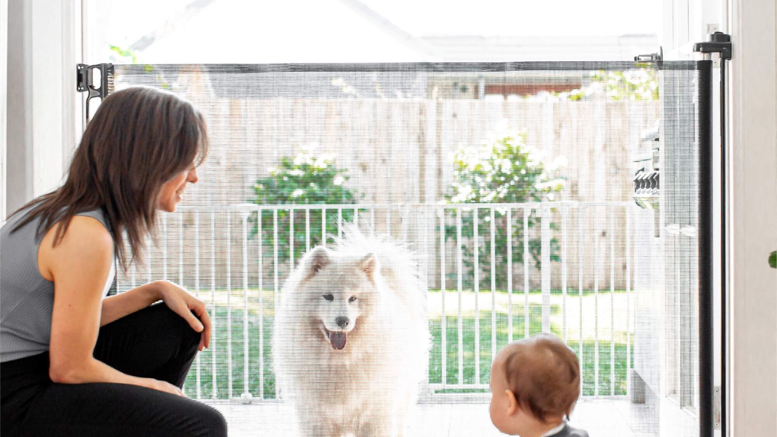 Parent and toddler by a home safety gate