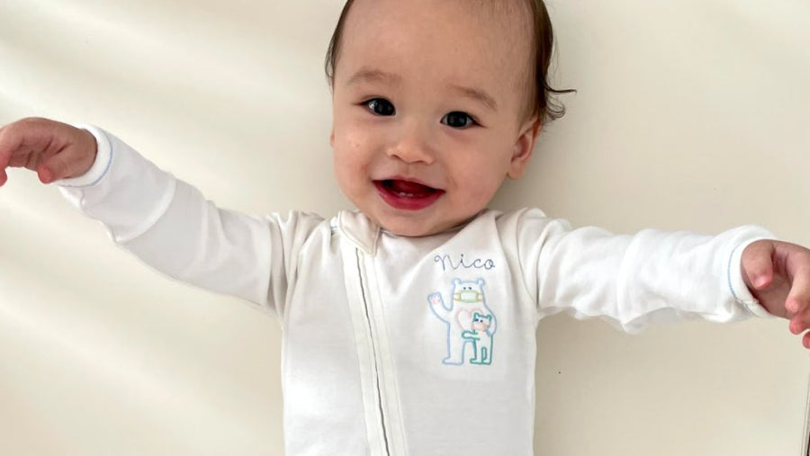 Baby in a personalized gown