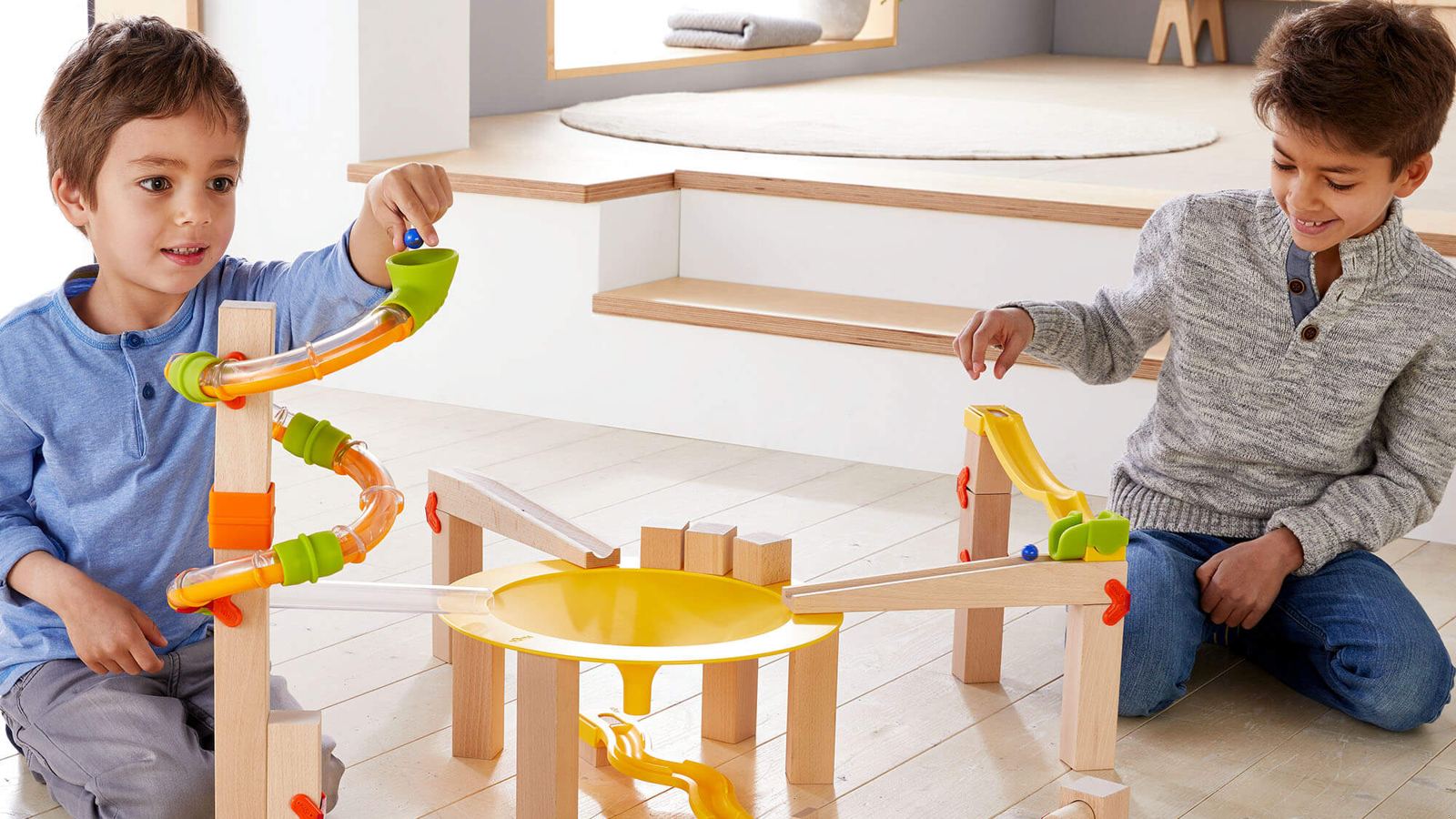 Children playing with a marble run