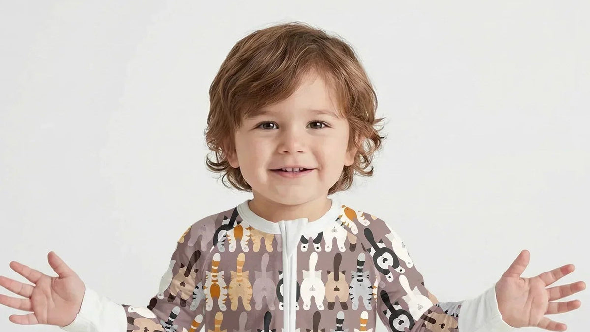 Toddler smiling in a Zumbamboo Cheeky Tails bamboo convertible zippy