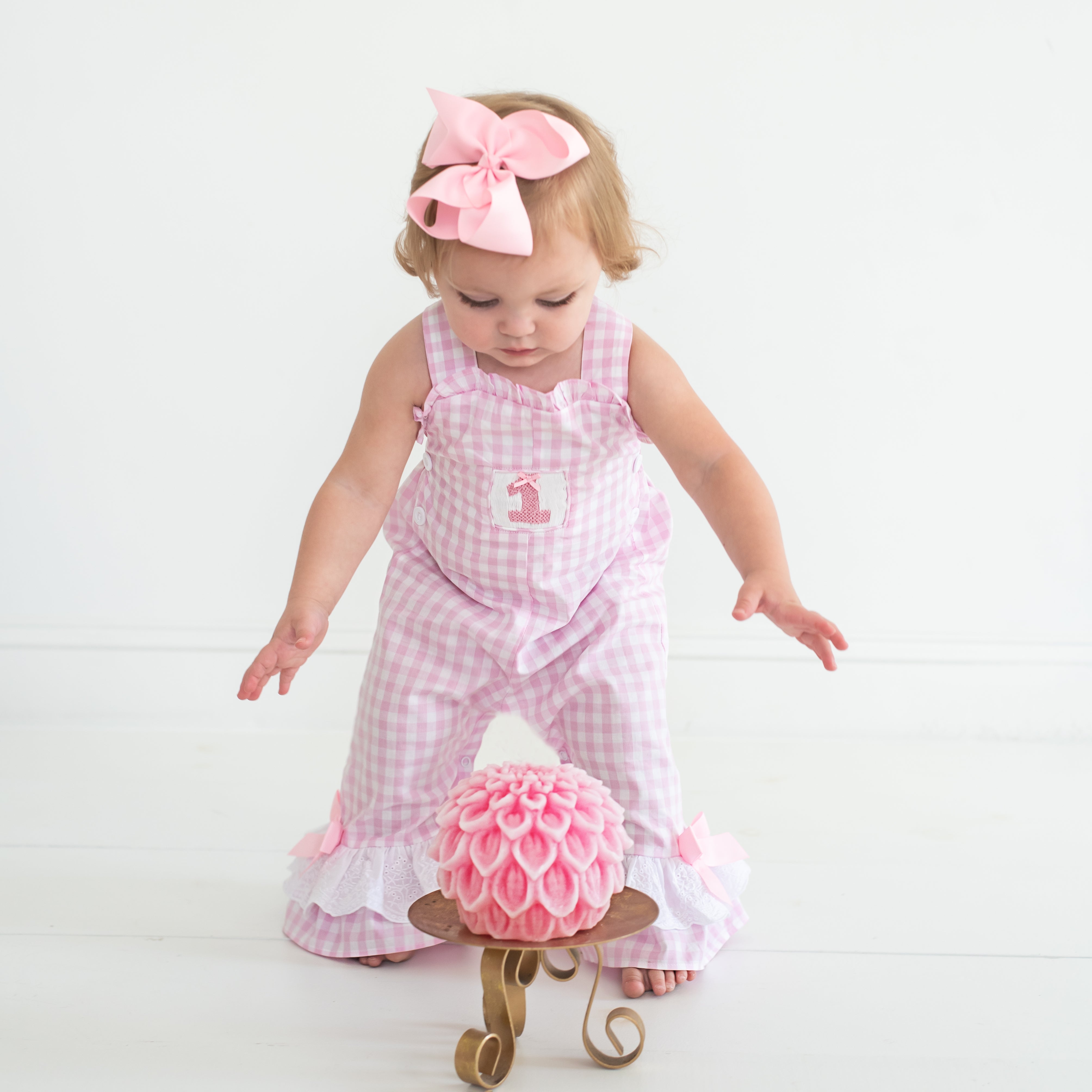 Toddler model in Seven Lantern Lane smocked longall