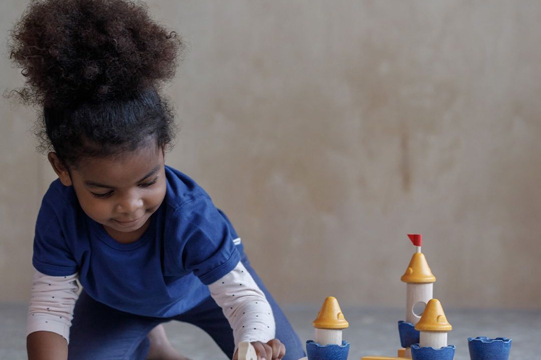 Baby playing with wooden blocks