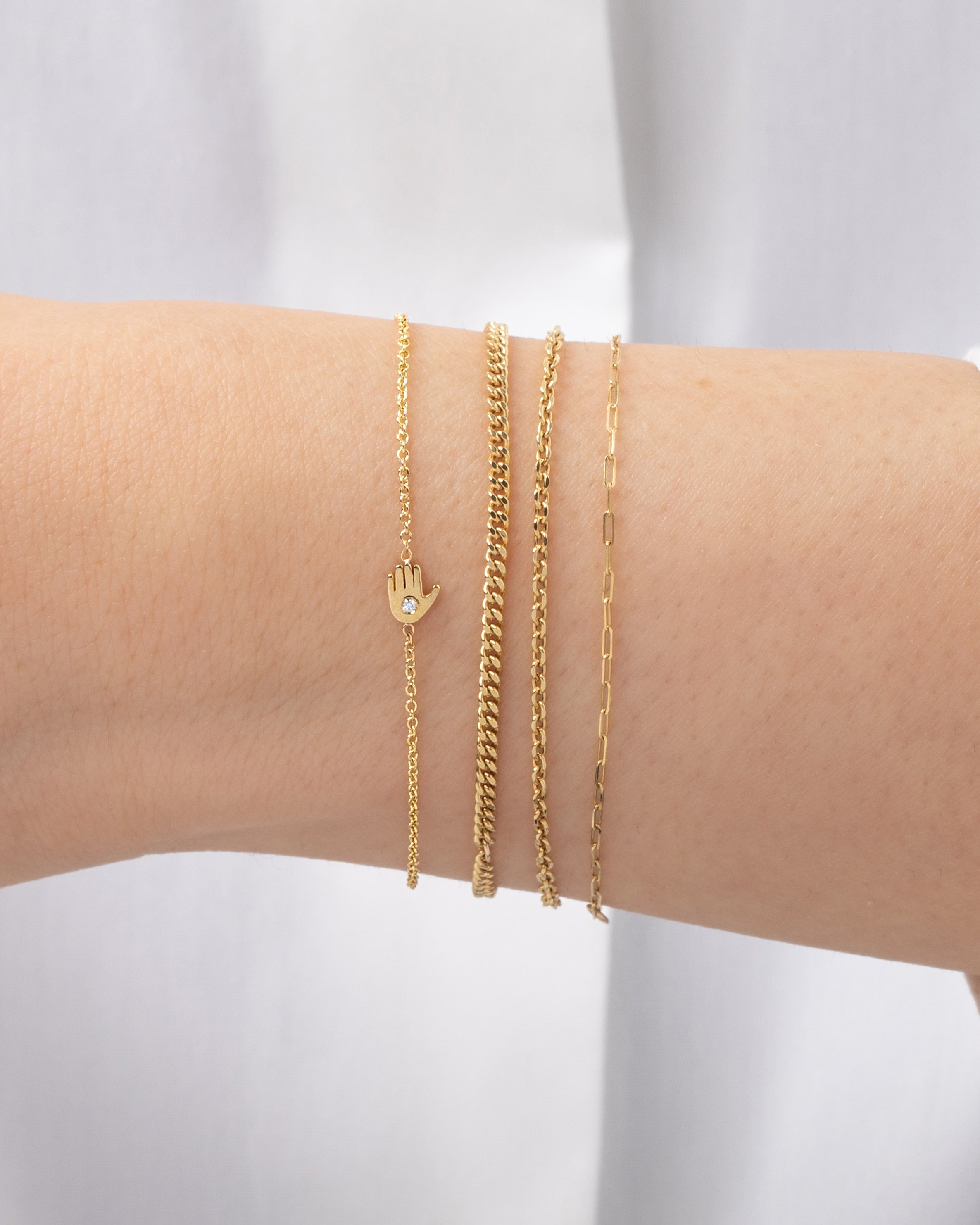 14k Gold Tiny Hamsa Bracelet With Diamond