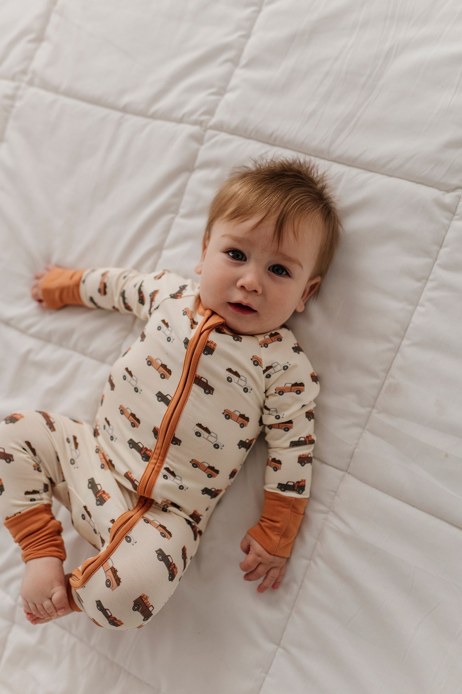 Baby Boy Long Sleeve Zip Romper In Pumpkin Trucks