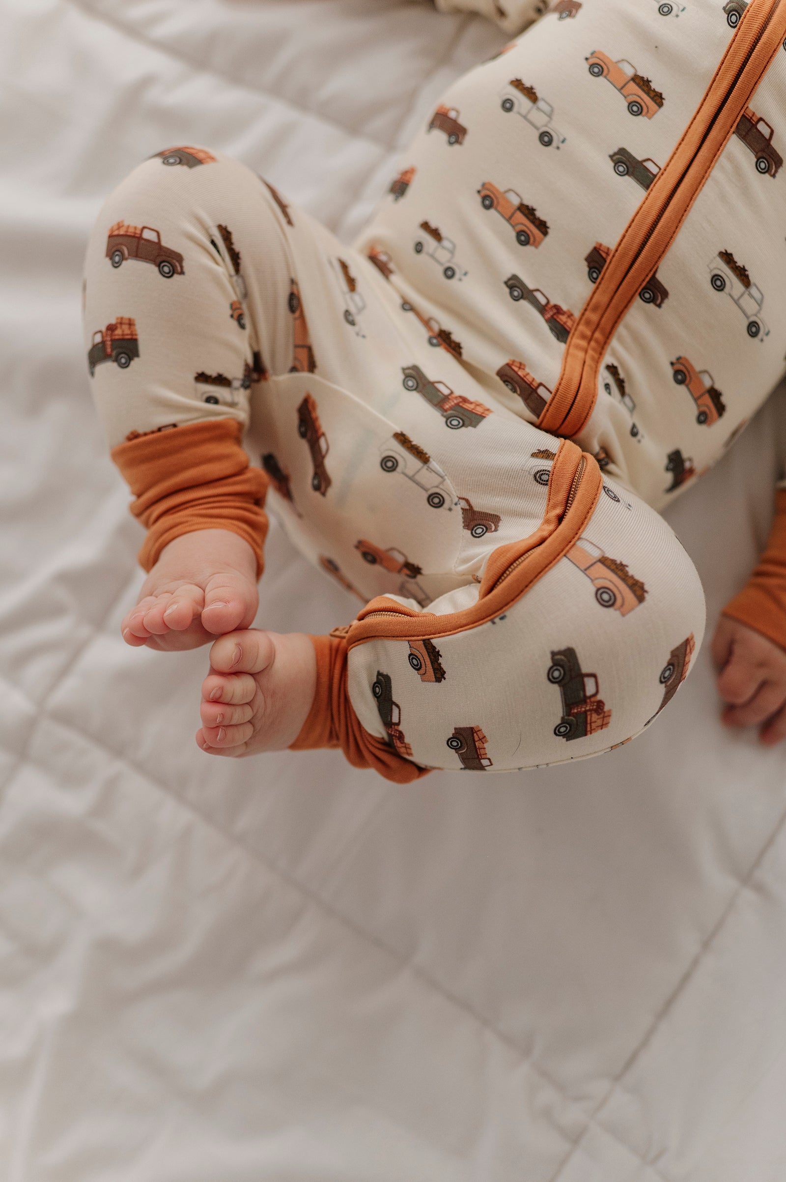 Baby Boy Long Sleeve Zip Romper In Pumpkin Trucks