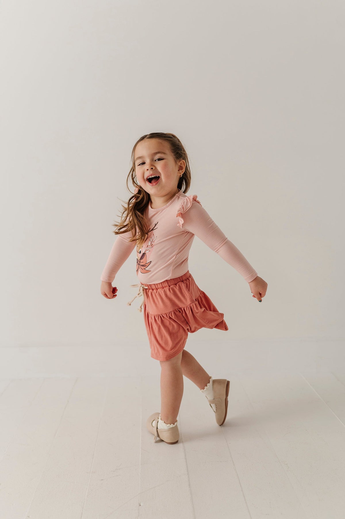 Girls Long Sleeve Ruffle Top In Reindeer On Holiday Blush