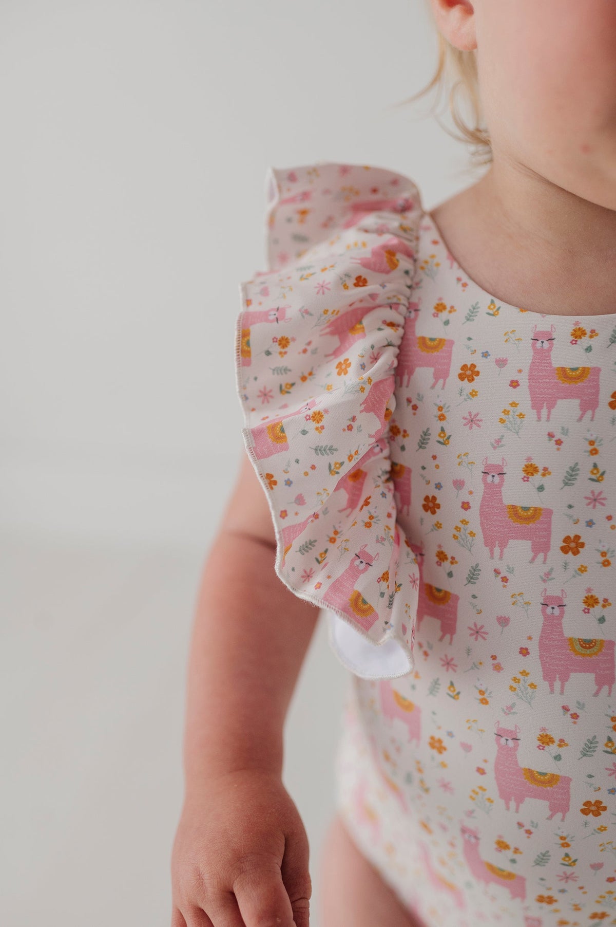Baby Girl Ruffle Sleeve Cross Back Swimsuit In Llamas