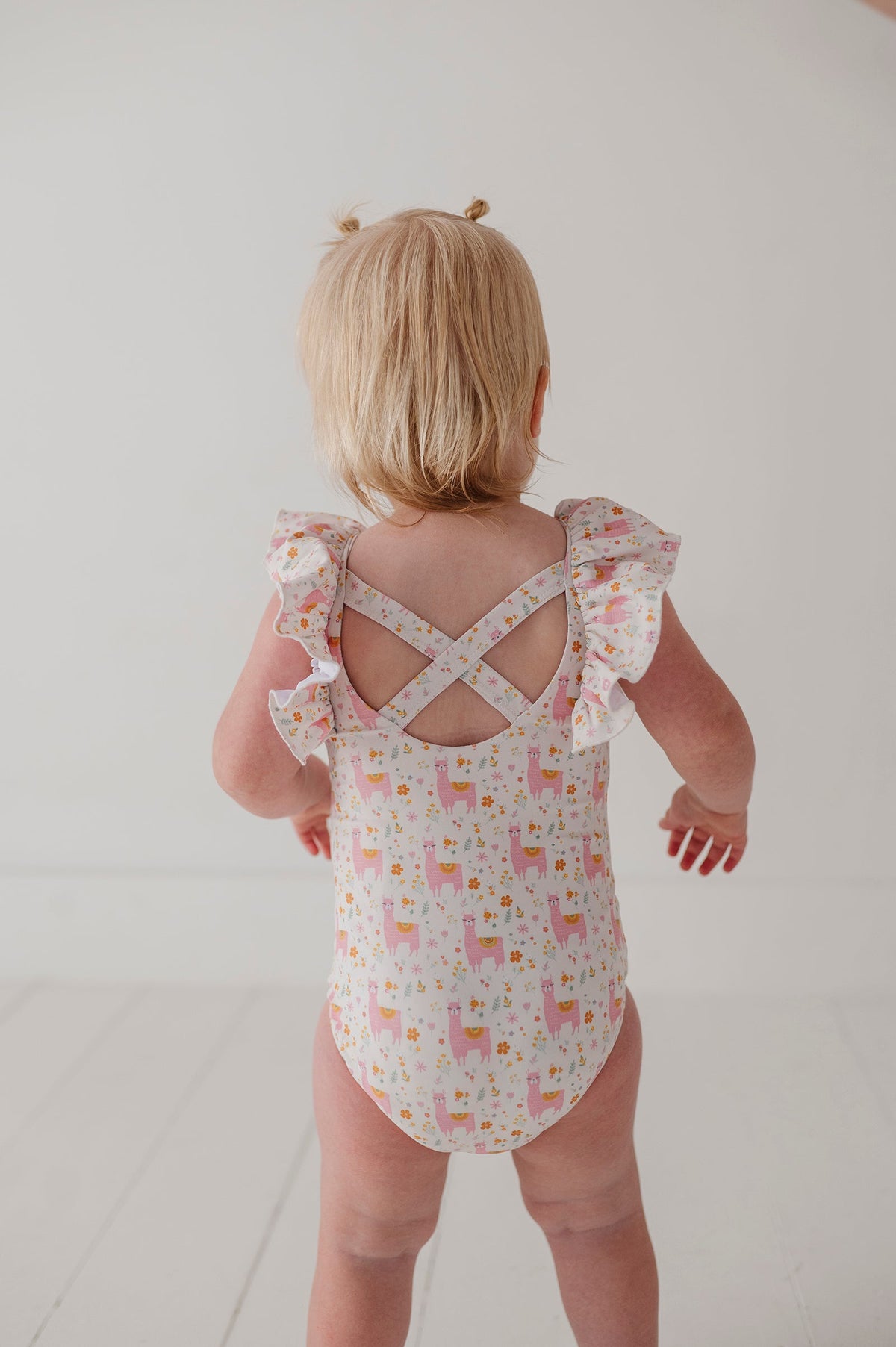 Baby Girl Ruffle Sleeve Cross Back Swimsuit In Llamas