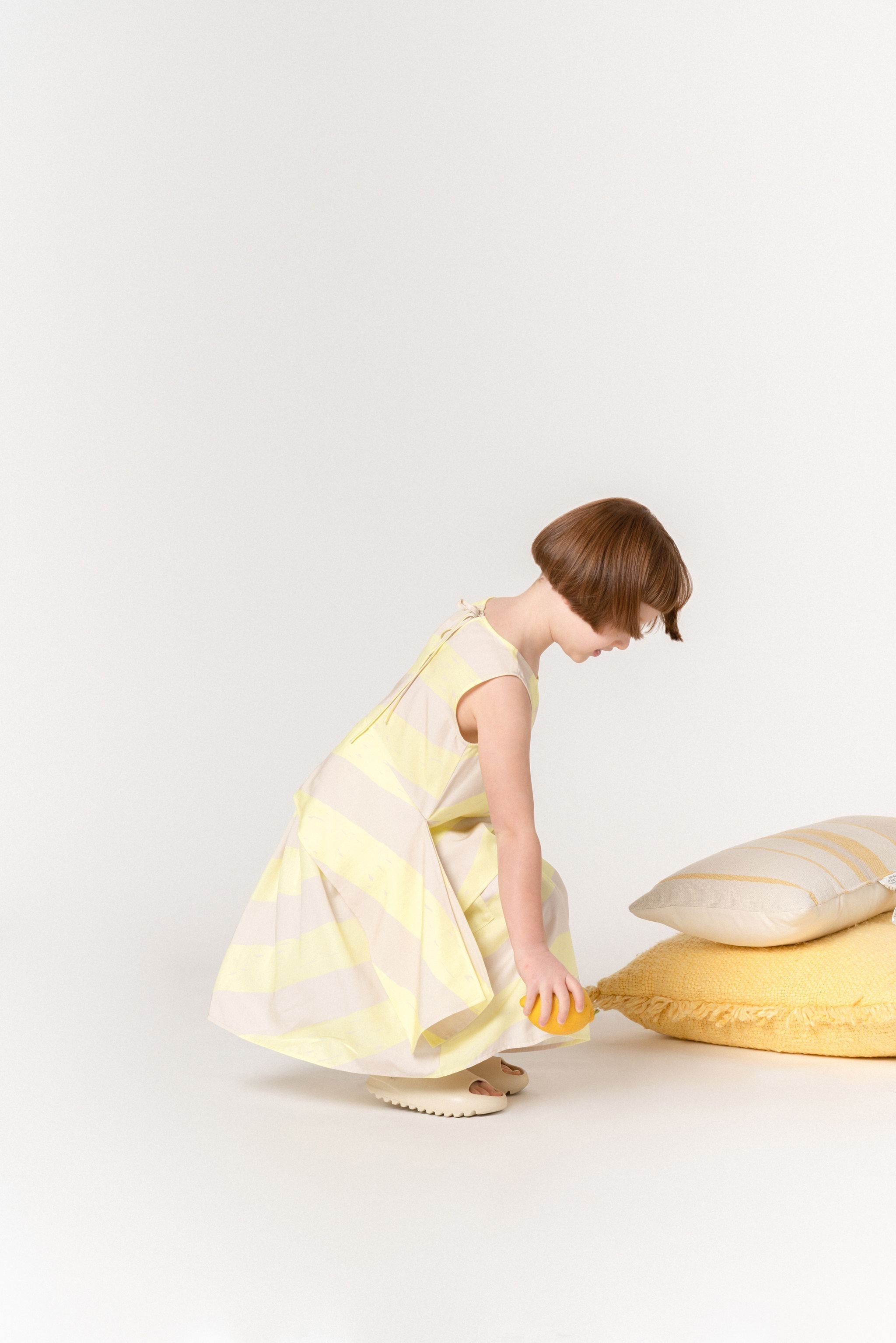 Girls Sleeveless Peplum Top With Side Tails | Yellow