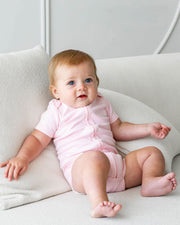 Short Sleeve Zipper Bodysuit In Blush, 0-3m