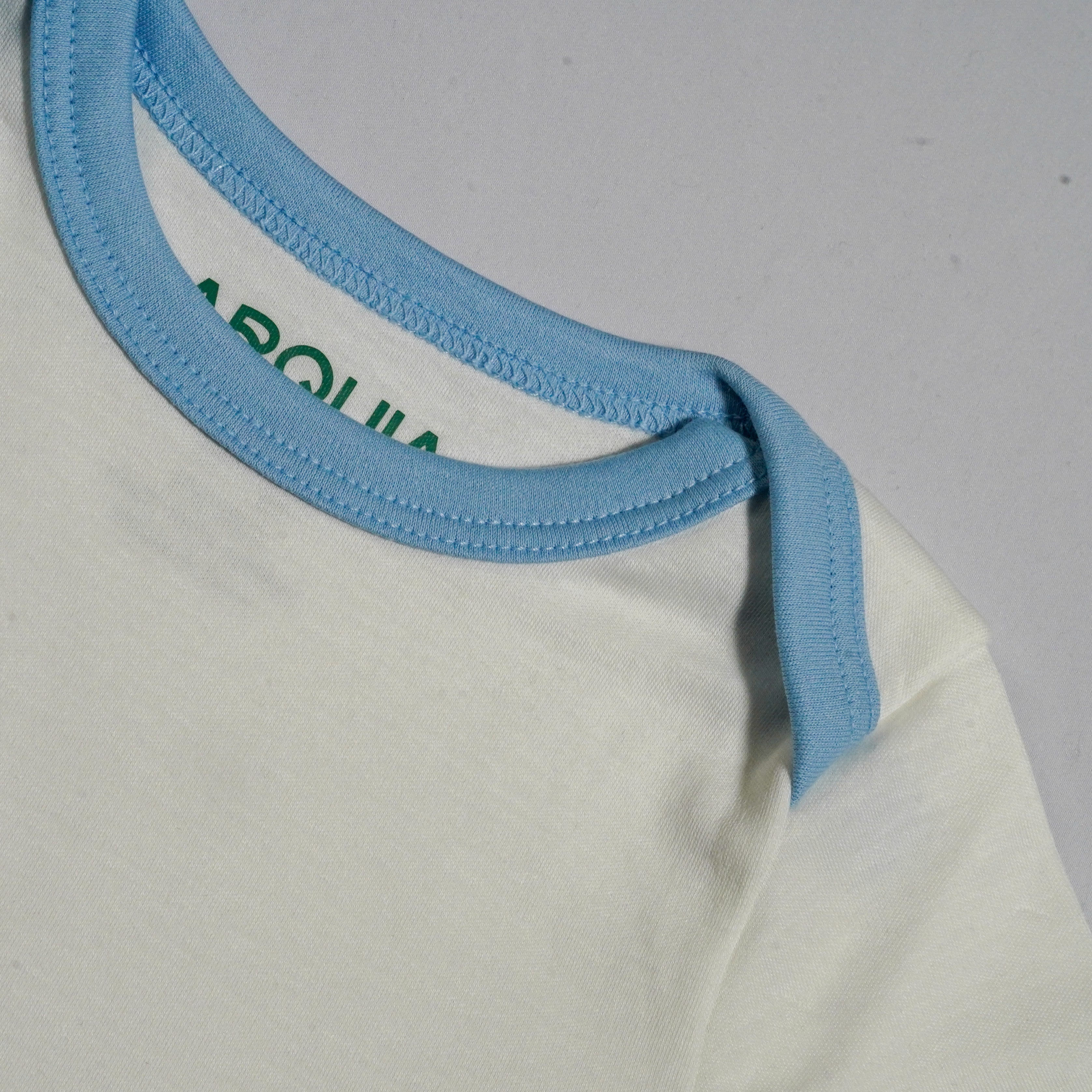 Long Sleeve Bodysuit In White With Chambray Blue