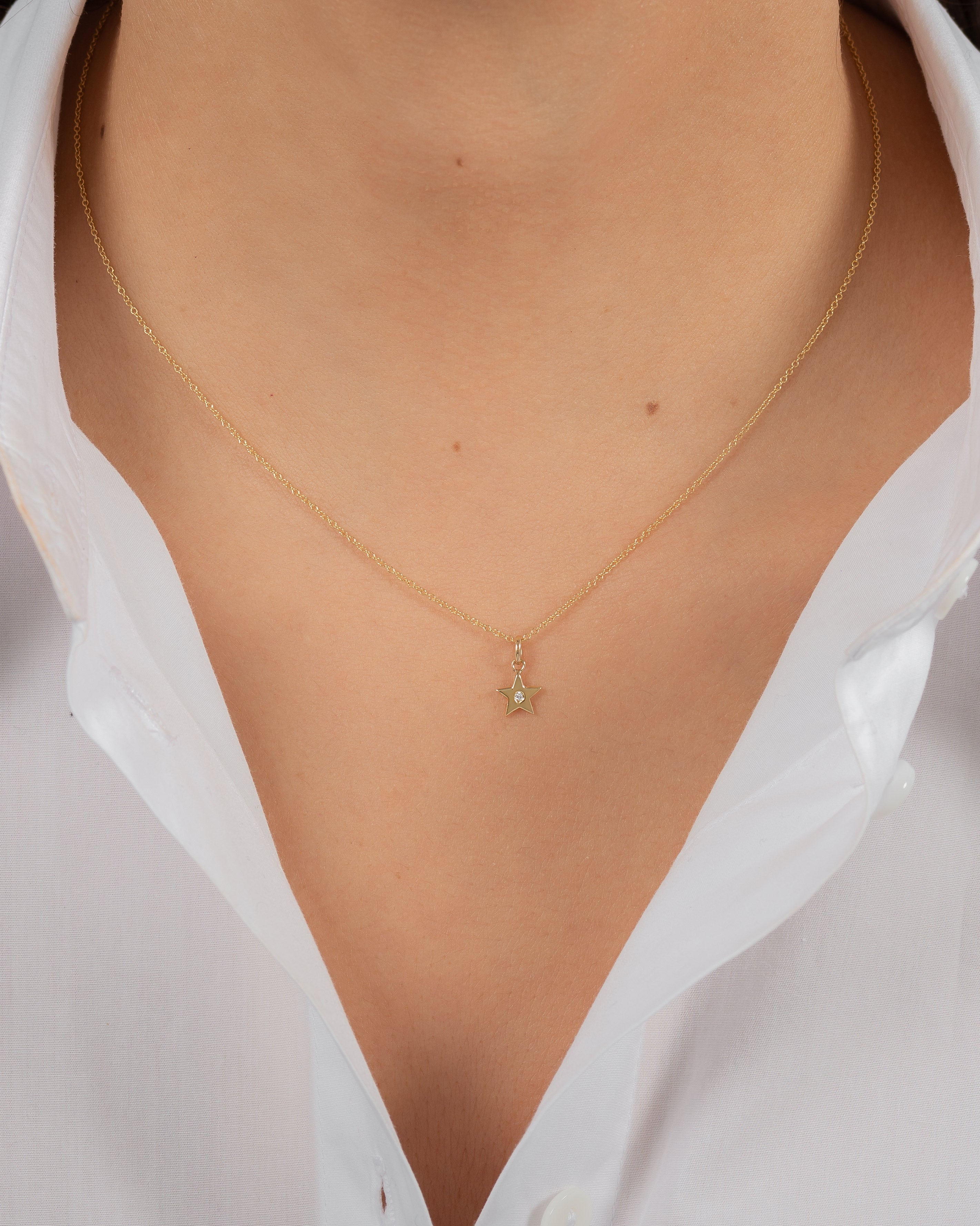 14k Gold Star With Tiny Diamond Pendant